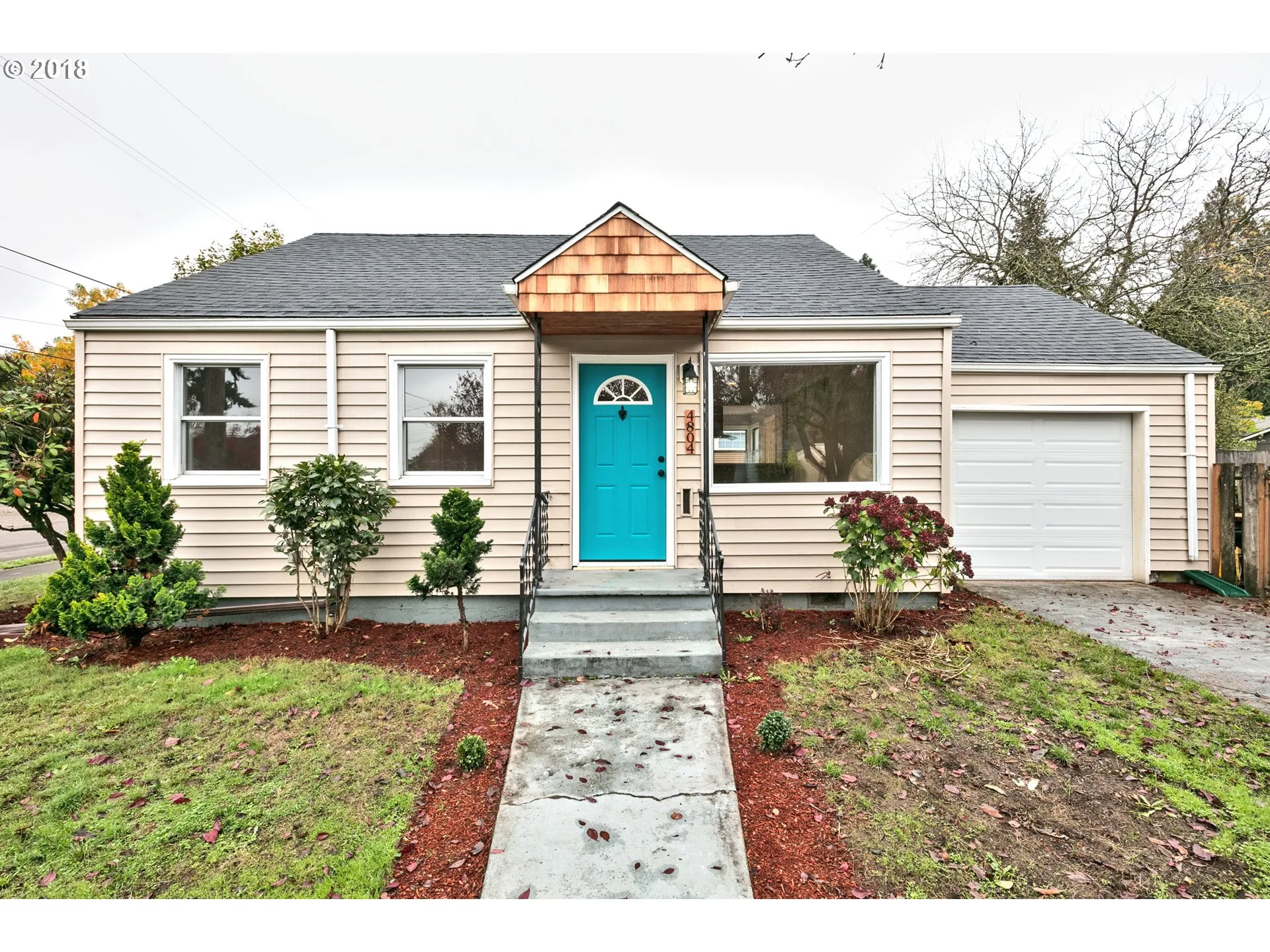 Renovated Portland bungalow with new entry door and replacement windows
