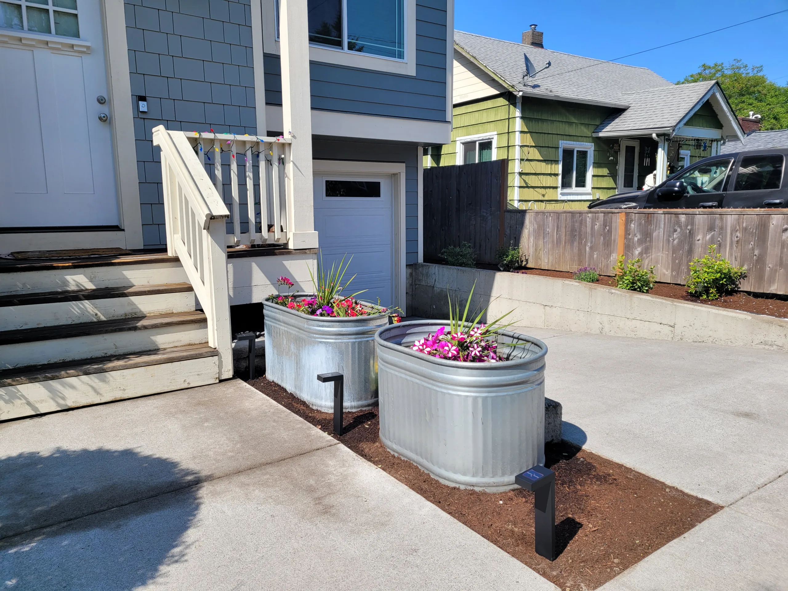Completed outdoor hardscape with paver entry and landscaping in Portland